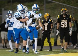 South Park's Logan Ludwig (right) celebrates with teammate Conor Quinn (50) after scoring a fourth-quarter touchdown Friday, Aug. 29, 2025, at Deer Lakes.