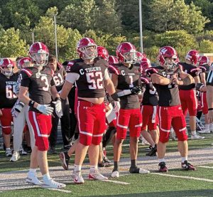 Moon captains head to midifield for the coin toss before their game against Montour on Aug. 29, 2025, at Montour.