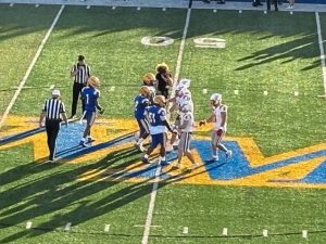 Players from Avonworth and West Mifflin meet for the coin toss before their game Friday at West Mifflin.