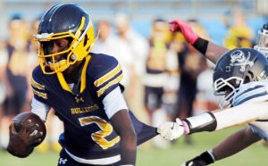 Shady Side Academy quarterback Javon Johnston pulls away from Burrell's Liam Kasavage to score a touchdown in the first quarter Friday, Aug. 29, 2025, at Farrell Stadium.