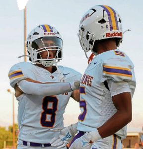 Plum's Eugene Hanzlik (left) and Sloan Humphries celebrate a touchdown against Franklin Regional on Friday, Aug. 22, 2025.