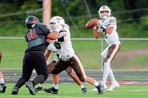 Highlands quarterback Jamarkus Prager looks to pass against Elizabeth Forward on Aug. 29, 2025.