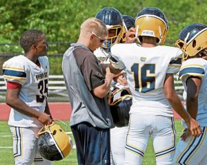 Shady Side Academy coach Andrew Geisler works with his team during practice last month.