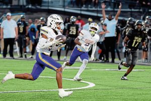 Plum’s Sloan Humphries scores on a long touchdown run against Gateway on Friday.