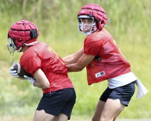 North Catholic quarterback Joey Felitsky hands off to Logan Schade during practice on Friday, Aug. 8, 2025, at J.C. Stone Field in North Park.