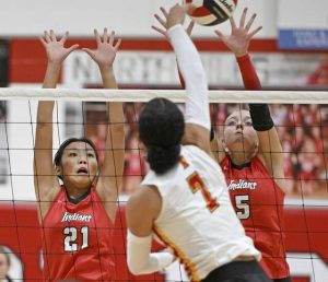 North Hills’ Sofia Rodriguez (l) and Aslyn Fazio go up for a block against North Catholic on Sept. 9.
