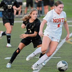 Quaker Valley’s Eliza Rahm defends North Catholic’s Lily Karsman on Sept. 6, 2023, in Leetsdale. Quaker Valley coaches said Rahm was the MVP of a 4-0 win over Sewickley Academy this month.