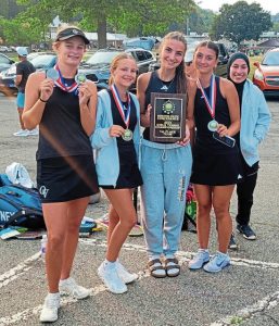 Quaker Valley girls tennis team members, from left, Kate Miller, Avery Allan, Livia Jobbins and Noor Ashfaq, proudly display the MAC championship plaque.