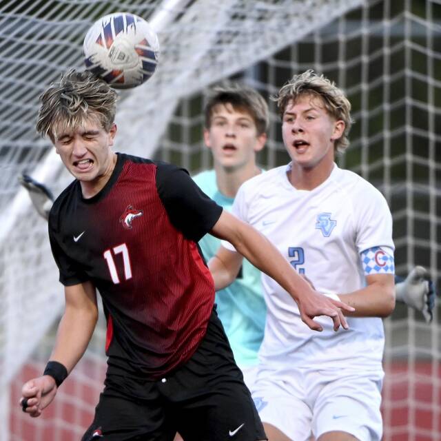 Fox Chapel’s Nicolas Squeglia heads the ball in front of the Seneca Valley goal next to Fynn O’Donnell on Tuesday, Sept. 9, 2025, at Fox Chapel.