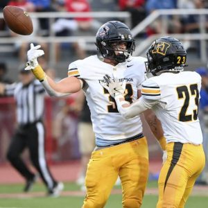 Thomas Jefferson’s Dom Volomino celebrates his 46-yard reception with Jaxson Kolling last Friday.