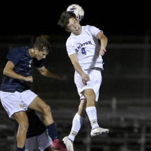 Hampton’s Xavier Ware battles Mars’ Frank Knezovich for a header last season.