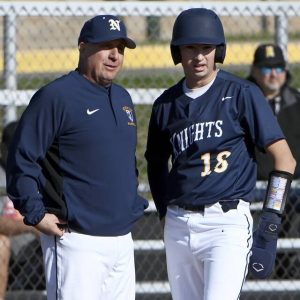 Norwin head coach Craig Spisak talks with Matt O’Neil during a game at North Allegheny in 2024.