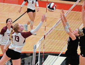Eden Christian junior hitter Ava Arnold (right) is among the returning starters for the Eden Christian girls volleyball team.