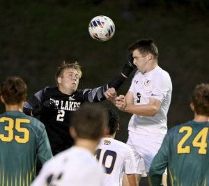 Deer Lakes goalkeeper Wesley Boyle makes a save on Shady Side Academy’s Mark Bence on Aug. 28.