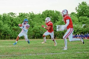 Jeannette’s Hunter Schaeffer looks for running room against Frazier on Friday.