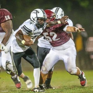 Monessen's Tavian Taylor stiff-arms Serra Catholic's Loukas Nyapas on Friday, Sept. 12, 2025.