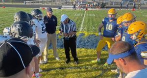 Burrell (left) and Derry gather before kickoff of their game Friday, Sept. 12, 2025.