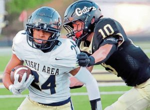 Kiski Area running back Ashton Taylor attempts to shed Gateway’s Jakson Smith during the first quarter Friday.