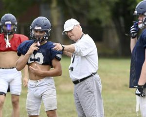 Rochester head coach Don Phillips works with his team during practice on Wednesday, Aug. 20, 2025, in Rochester.