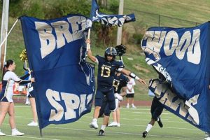 Brentwood's Cedric Davis Jr. runs through the flag before playing Springdale on Sept. 12, 2025, at Brentwood Park.