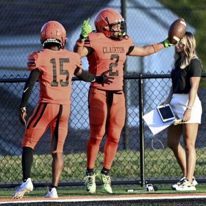 Clairton’s Donte Wright (2) celebrates with Rheyjon Williams after his interception in the end zone against Imani Christian on Aug. 22 at Tyler Boyd Stadium.