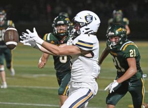 The aptly named Jake Knight of Norwin gets past Penn Trafford’s Brent Lenart but can’t haul in a pass Aug. 22.