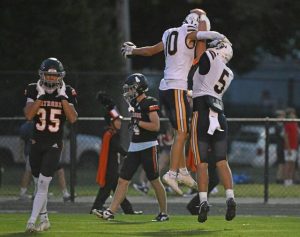 Norwin’s Josh Lenart (5) celebrates with Potter Brozeski after a second-quarter touchdown against Latrobe on Sept. 5.