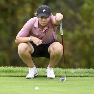 Fox Chapel’s Carson Kittsley eyes up his putt on No. 9 during the 2024 WPIAL Class 3A golf championship at Oakmont Country Club.