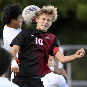 Fox Chapel’s Rocco Didomenico battles Seneca Valley’s Luke West for a header Sept. 9.