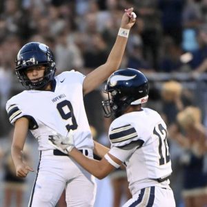 Hopewell kicker Rocco Marcantiono (9) celebrates his 55-yard field goal with holder James Gill against Avonworth on Friday.