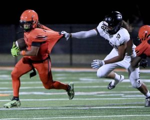 Clairton’s Donte Wright tries to elude Imani Christian’s William Gorman during their game on Friday, Aug. 22, 2025, at Tyler Boyd Stadium.