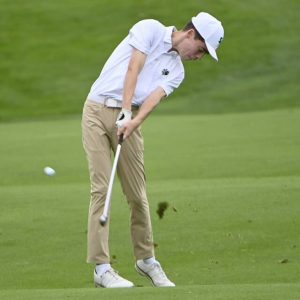 South Fayette’s Sam Bishop hits his fairway shot on Hole 18 during the WPIAL Class 3A boys golf championship on Tuesday, Oct. 1 2024, at Oakmont Country Club.