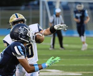 Burrell’s Vincent Scherer (front) hauls in a pass over Freeport’s Kason Barker on Sept. 19.