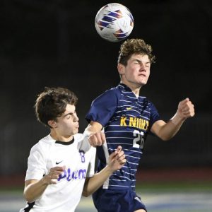 Plum’s Christian Alter battles Norwin’s Jack Lepore for a header Sept. 18.