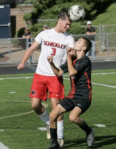 Sewickley Academy’s Blake Wilmot heads the ball in front of Springdale’s Jackson Muller during a WPIAL Class A first-round playoff game last season.