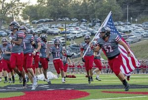 Southmoreland's Jake Govern leads the team onto the field for a game against Ringgold on Friday, Sept. 19, 2025.