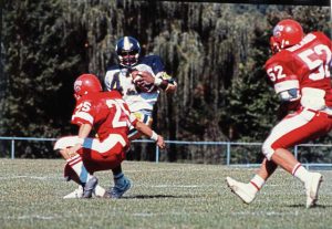 Asayan Jordan of Kiski Area puts a move on Fox Chapel’s Matt Quince (25) with Joe Orlando (52) in pursuit Sept. 28, 1985. Jordan tallied four rushing touchdowns in a 28-0 victory for the 5-0 Cavaliers.
