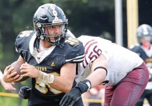 Riverview running back Miles Duncan looks upfield before being wrapped up by Greensburg Central Catholic’s Aiden Lent on Saturday.