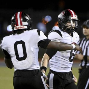 Aliquippa’s Joseph Work celebrates with Cleaster Longmire after defeating Mars on Friday, Sept. 12, 2025, in Adams.