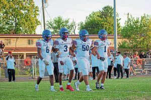 Jeannette captains, from left, Nick Mendoza, Kymon'e Brown, Carmine Deannutis and Jayce Powell head to midfield before their game against Frazier on Sept. 12, 2025, at Frazier.