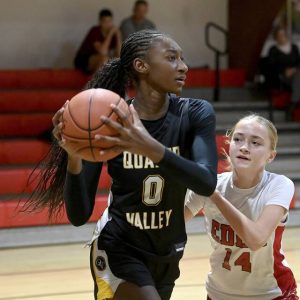 Quaker Valley’s Mimi Thiero works against Eden Christian Academy’s Leah Wallace on Dec. 4, 2024.