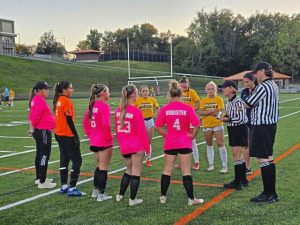 Latrobe (front) and Norwin girls soccer players meet before their game Wednesday.