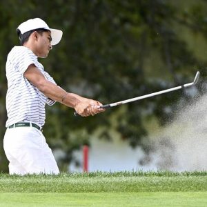 North Allegheny’s Ravi Desai hits out of a bunker on No. 11 during the WPIAL Class 3A boys golf championship Sept. 29 at Butler Country Club.