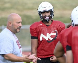 New Castle’s Jayden Shaffer listens to coach Fred Mozzocio during drills at practice on Thursday, Aug. 7, 2025, at Taggart Stadium in New Castle.