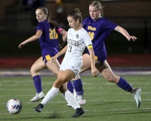 Franklin Regional’s Allyssa Velasquez moves the ball past Plum’s Addison French during their game on Monday, Aug. 25, 2025, at Plum.