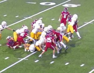 Mt. Pleasant's defense swarms at the line of scrimmage during a game against Greensburg Salem on Oct. 3, 2025.