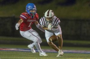 Jeannette’s Jayce Powell breaks up a pass intended for Greensburg Central Catholic’s Lucca Denis on Friday.