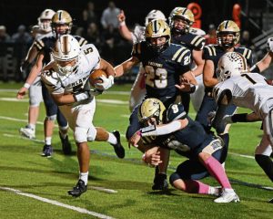 Highlands’ Tevin Owen-Cratsenberg plows into the end against Freeport for the decisive touchdown in overtime Friday.
