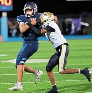 Burrell quarterback Antonio Perkins fights for yards against Valley's Raydn Thomas on Friday night at Burrell. The two were teammates on the Vikings' wrestling team last season.