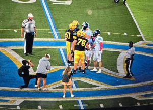 Canon-McMillan (left) and Seneca Valley meet before playing Friday, Oct. 3, 2025.